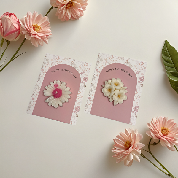 Two handmade soy wax candles shaped like flowers, each mounted on decorative cards with floral borders and "Happy Mother's.