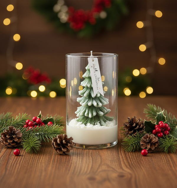 Glass jar candle with a detailed green pine tree shaped wax inside on wooden table with pinecones and red berries.