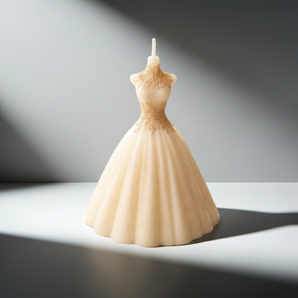 Ivory bridal wedding dress-shaped candle with intricate lace bodice details and full skirt.