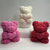 3D teddy bear candle made of intricate rose shapes holding a heart in pink, white, and red colors.