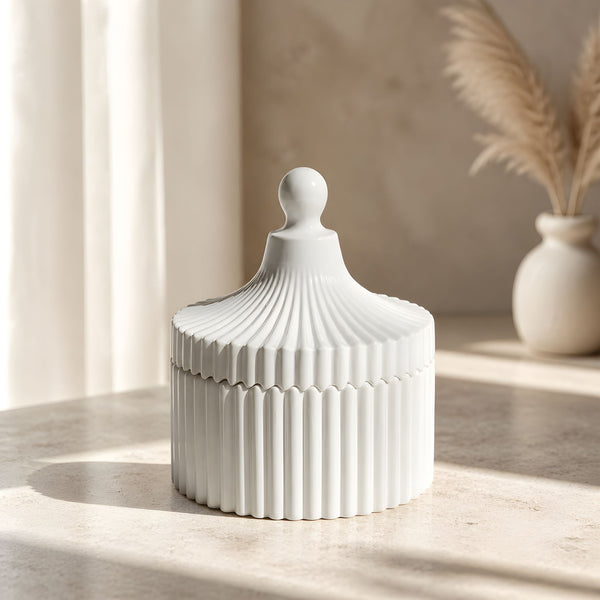 Handmade ceramic striped candle jar filled with natural soy wax and decorative modern design